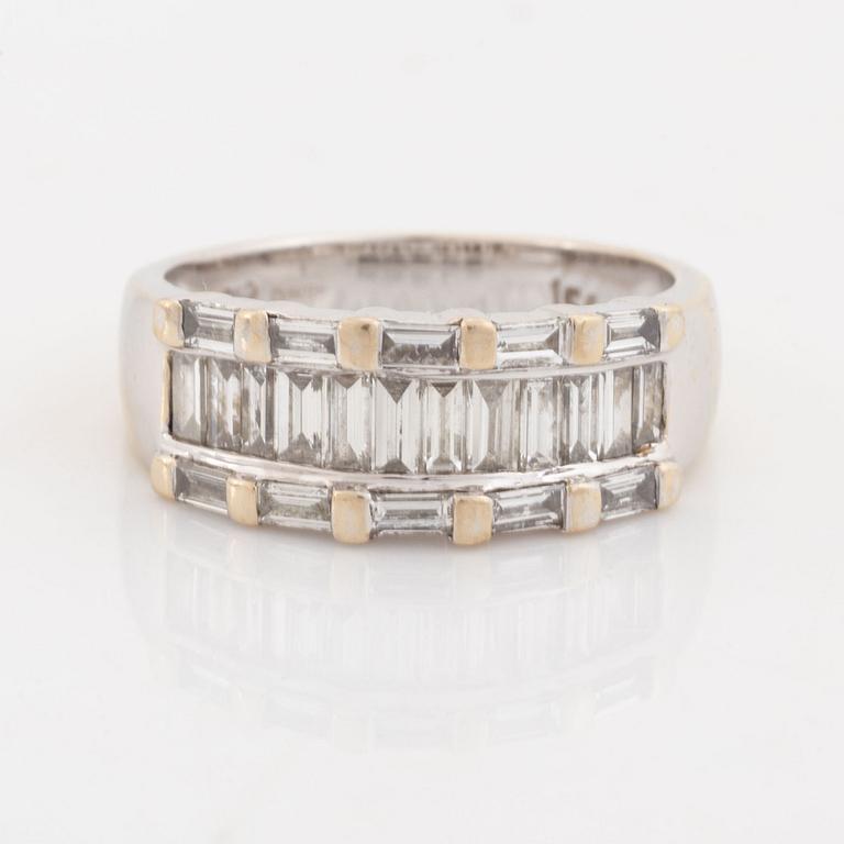 An 18K white gold ring set with baguette-cut diamonds.