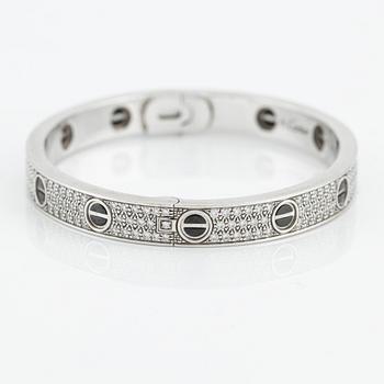 An 18K white gold Cartier bracelet "Love" with round brilliant-cut diamonds and ceramic.