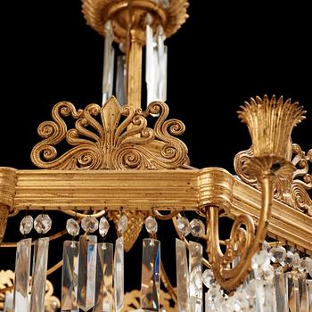 A German 19th century eight-light chandelier in the manner of Karl Friedrich Schinkel.