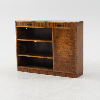 A stained birch veneered bookcase with cabinet, 1930's.