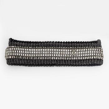 Chanel, a rhinestone headband.