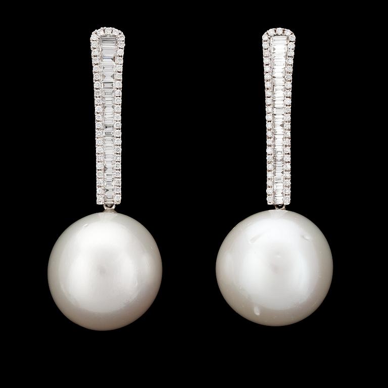 A pair of cultured South sea pearls, app. 17 mm, and diamond earrings, tot. app. 2 cts.
