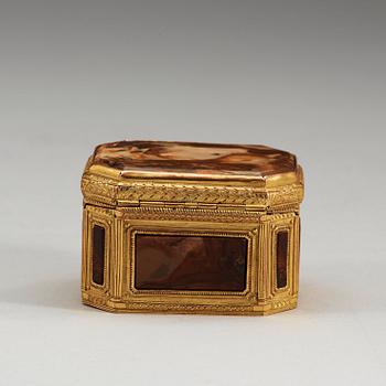 A gilt-brass, stone and glass box with double-folded lid with erotic scene. Louis XVI.