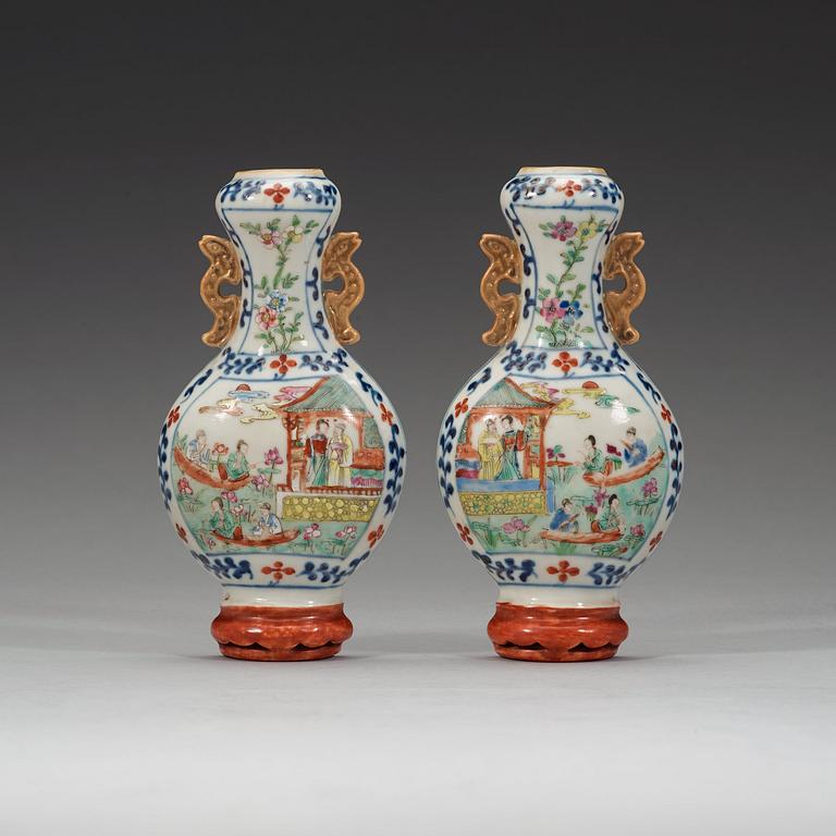 A pair of famille rose wall vases, late Qing dynasty, circa 1900.