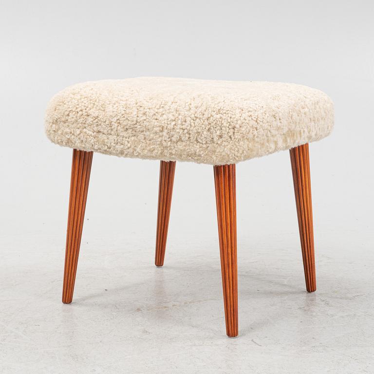 A Swedish modern shearling stool from the mid 20th century.