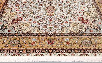 A part silk Tabriz carpet, so-called 50 Raj, approx. 348 x 252 cm.