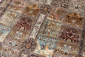 An oriental silk carpet, c. 305 x 205 cm.