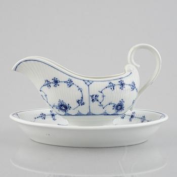 A 'Blue Fluted Plain' /'Musselmalet' sauce boat with stand, Royal Copenhagen, model 406 and 409, 1963 and 1893-1900.