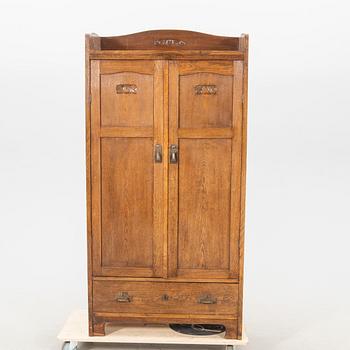 An early 1900s oak cabinet.