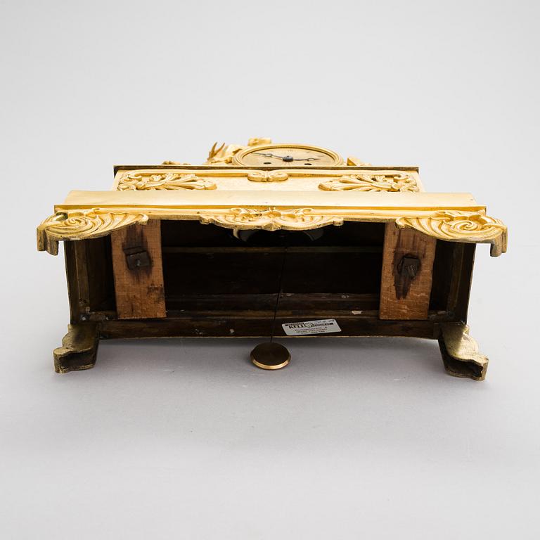 A French Empire mantel clock from 1820s-30s.