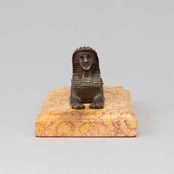 AN EMPIRE  BRONZE AND MARBLE PAPER WEIGHT, early 19th century.