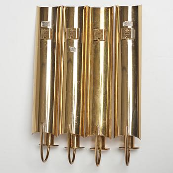 A set of four 'Reflex' brass wall scones by Pierre Forsell, Skultuna.