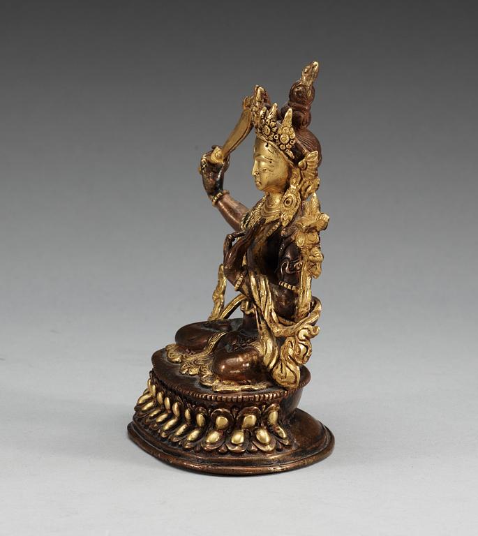 A Sino-tibetan gilt copper figure of a Bodhisattva, Qing dynasty, 19th Century.