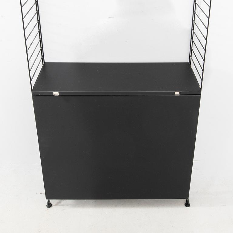 Nils Strinning, Hyllsystem.