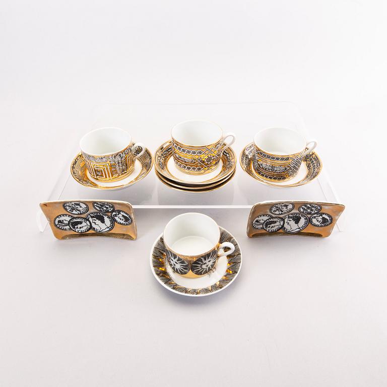Piero Fornasetti a set of four coffee cups with saucers and two ashtrays.