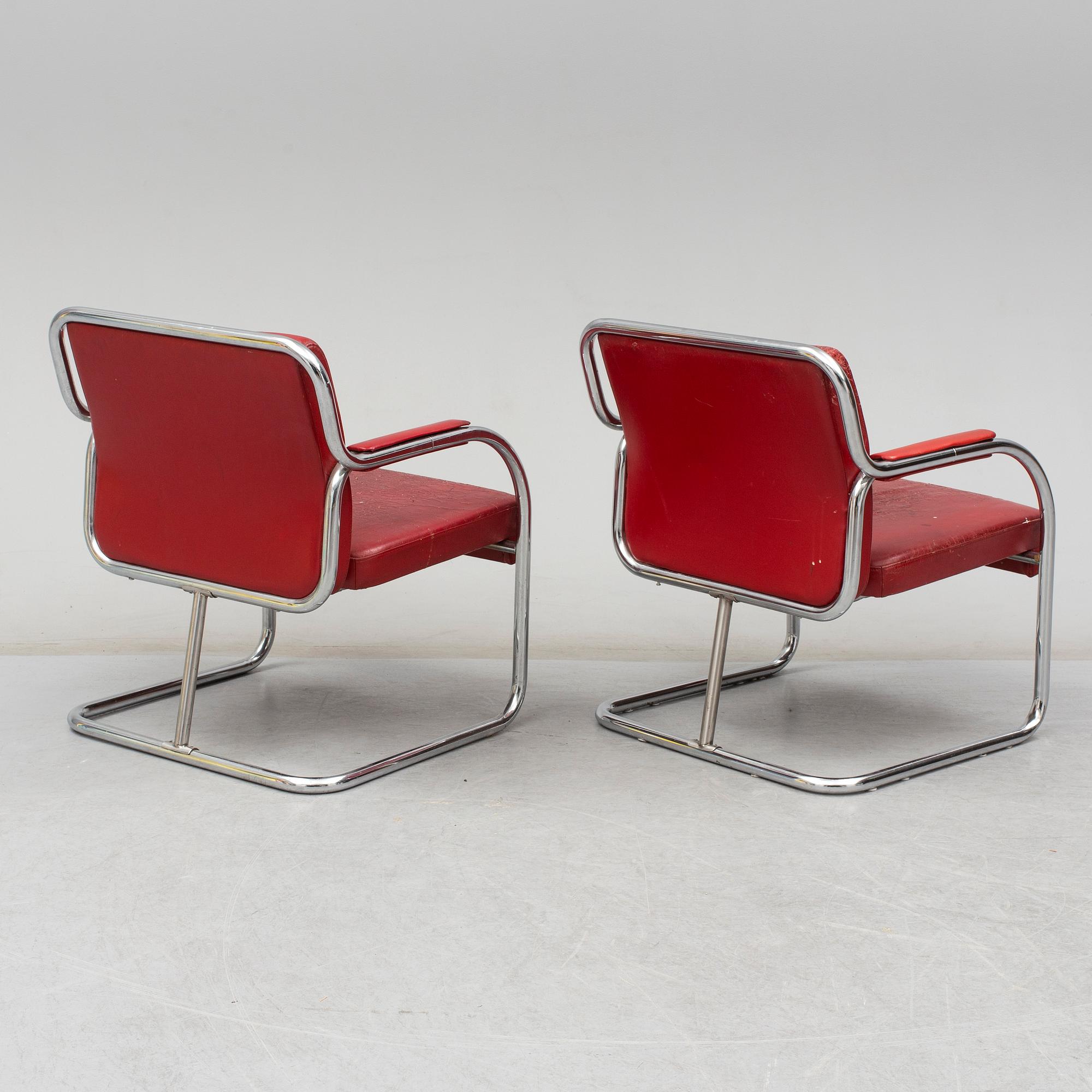 A pair of 1920s armchairs.