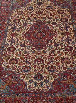 A CARPET, a semi-antique silk Kashan, ca 208,5 x 130 cm.