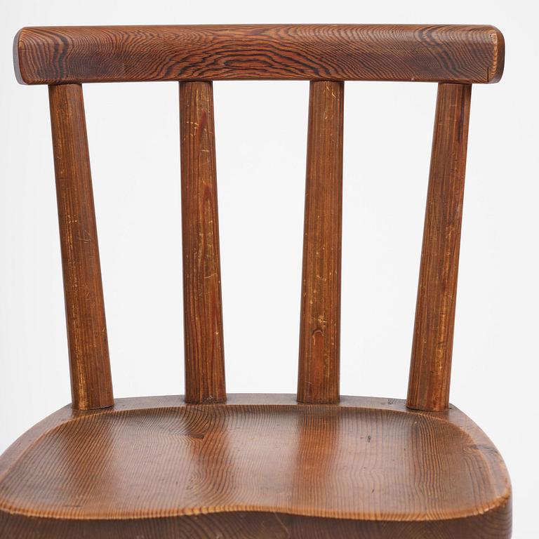 Axel Einar Hjorth, a set of four stained pine "Utö" chairs, Nordiska Kompaniet, Sweden, 1930s.