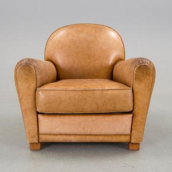A brown leather armchair by grange, the second half of the 20th century.