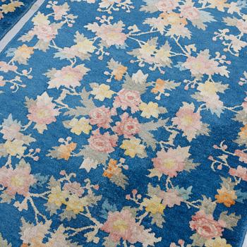 A pair of semi-antique/Old, Chinese rugs, ca 138 x 77 cm.