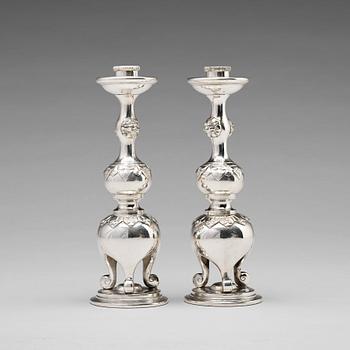 A pair of Chinese silver candle sticks, Shanghai, early 20th Century.