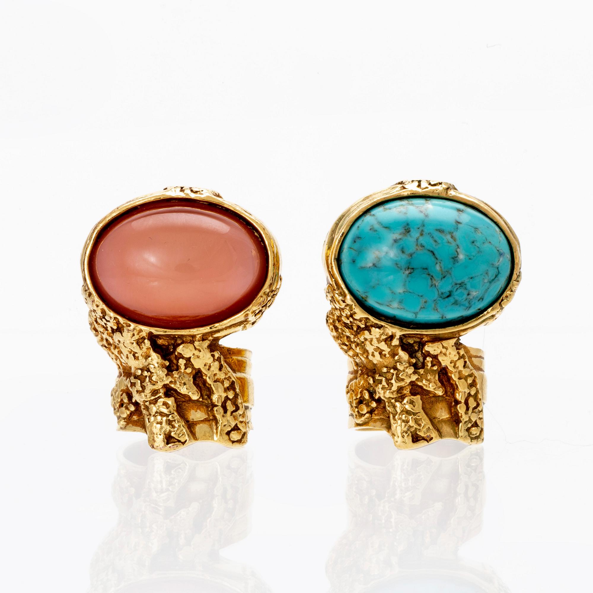 Yves Saint Laurent a set of two gold metal and stone Arty rings size 52 and 55. Bukowskis