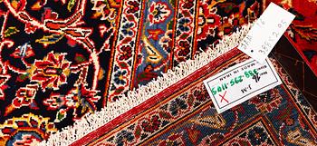A Kashan carpet, c. 388 x 295 cm.