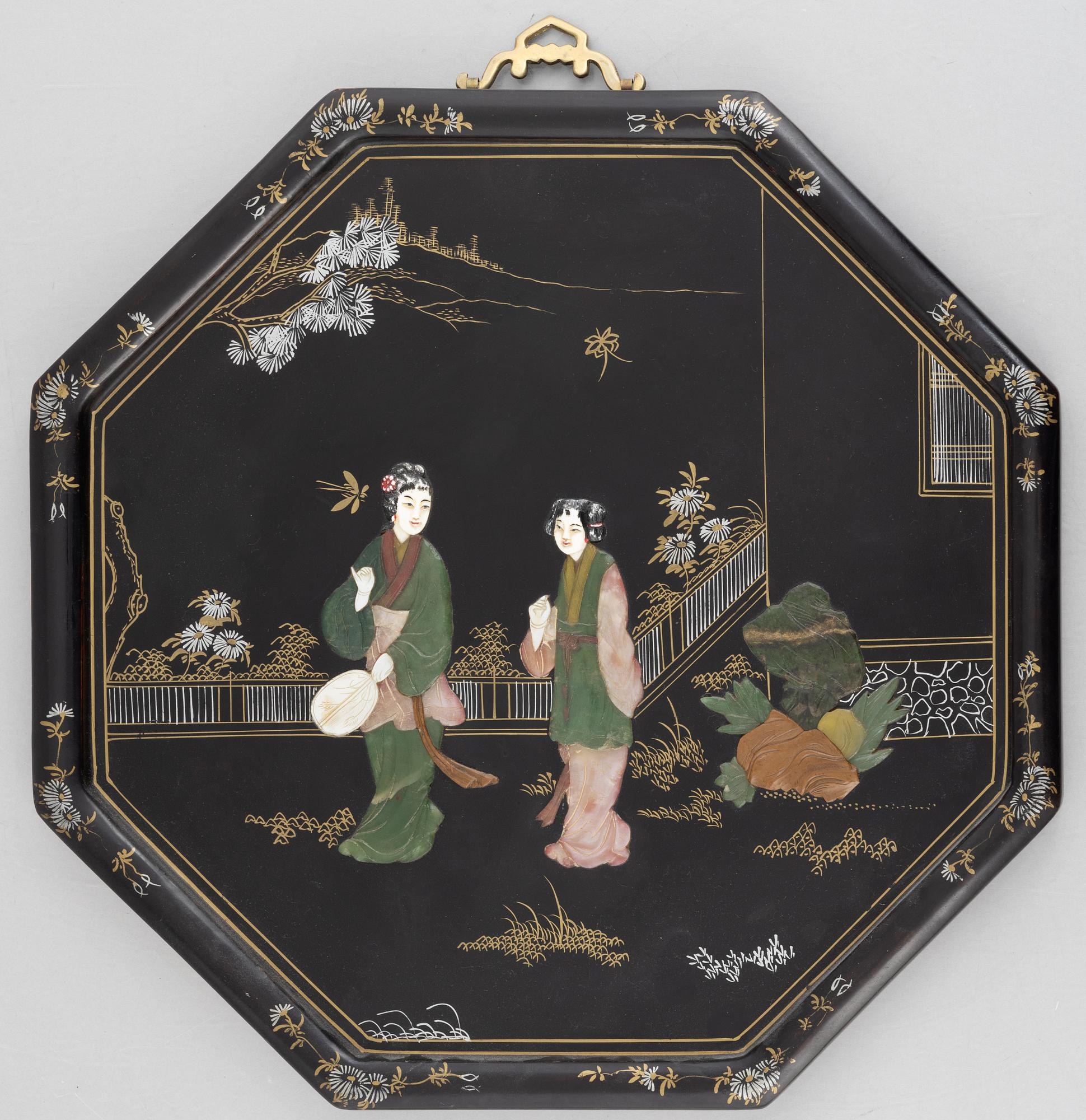 Four black-lacquered wall decorations, China, around 1900.