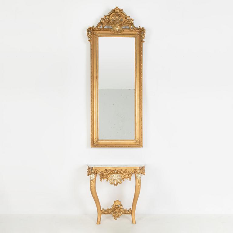 A rococo-style mirror and console table, around 1900.