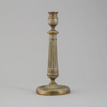 A first half of the 19th century Empire bronze candlestick.