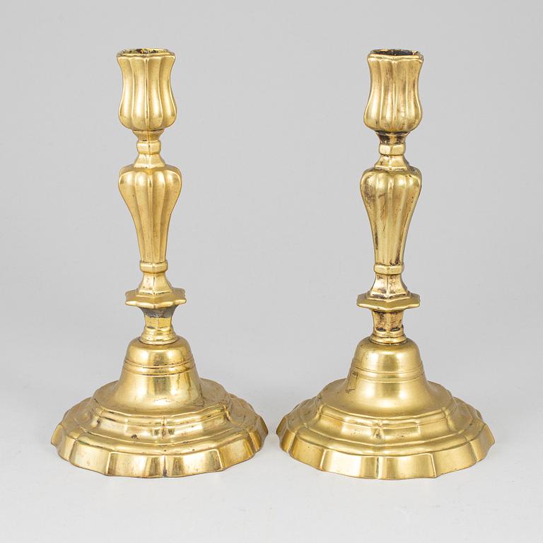 A pair of 18th century bronze candlesticks.