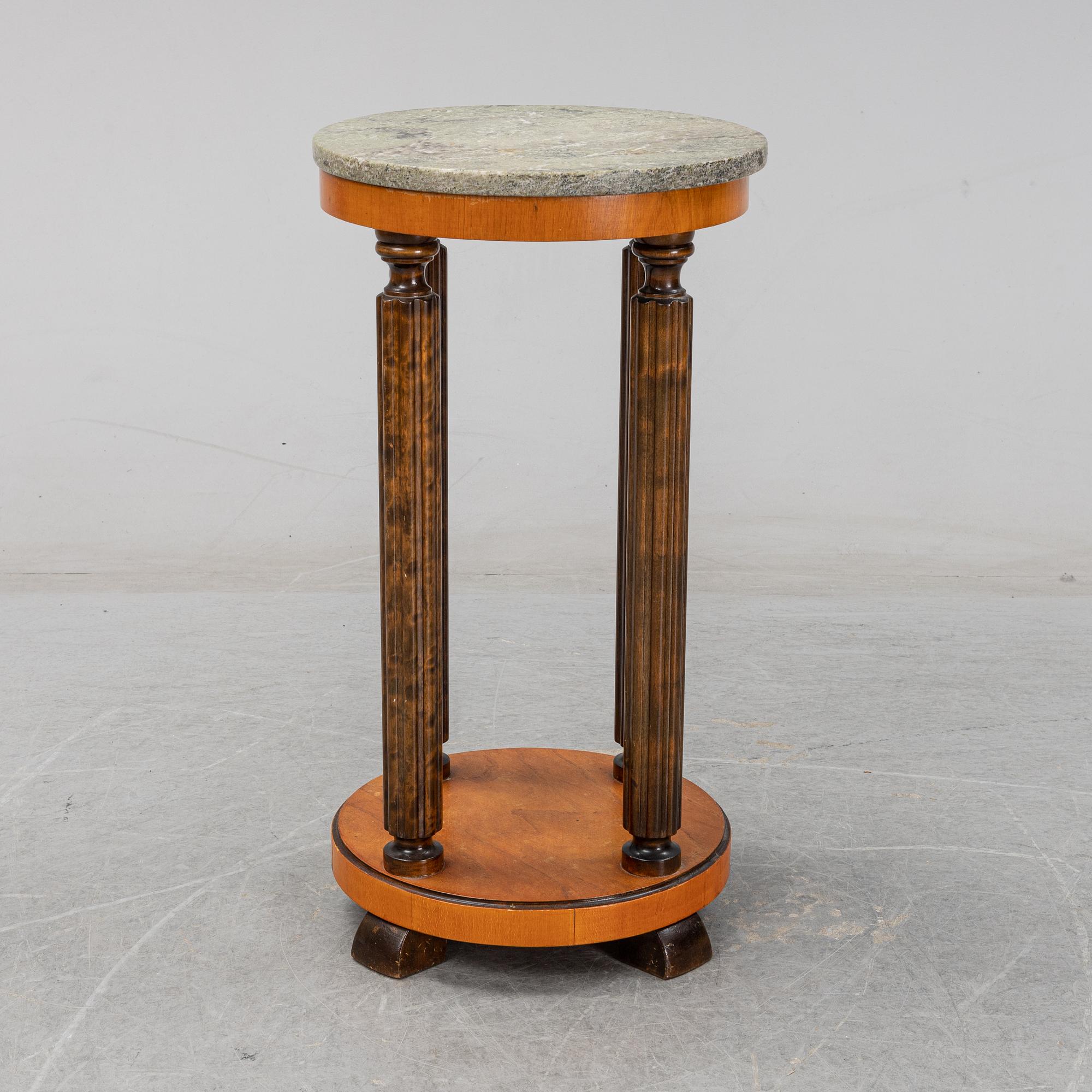 A stone top pedestal, 1920's/30's.