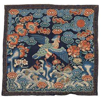 1203. An embroidered rank badge with a bird, Qing dynasty, 19th century.