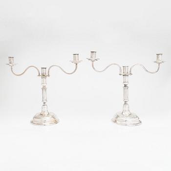 A pair of silver candelabra by Ferdinand Christian Krebs, Breslau, 1776-1792, with snuffers from Reval. Neo-classicism.