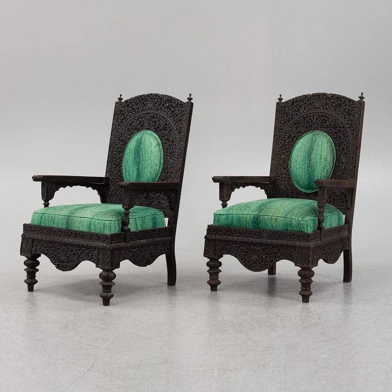 A pair of Angloindian carved chairs, India, 19th century, in so called 'Bombay style'.