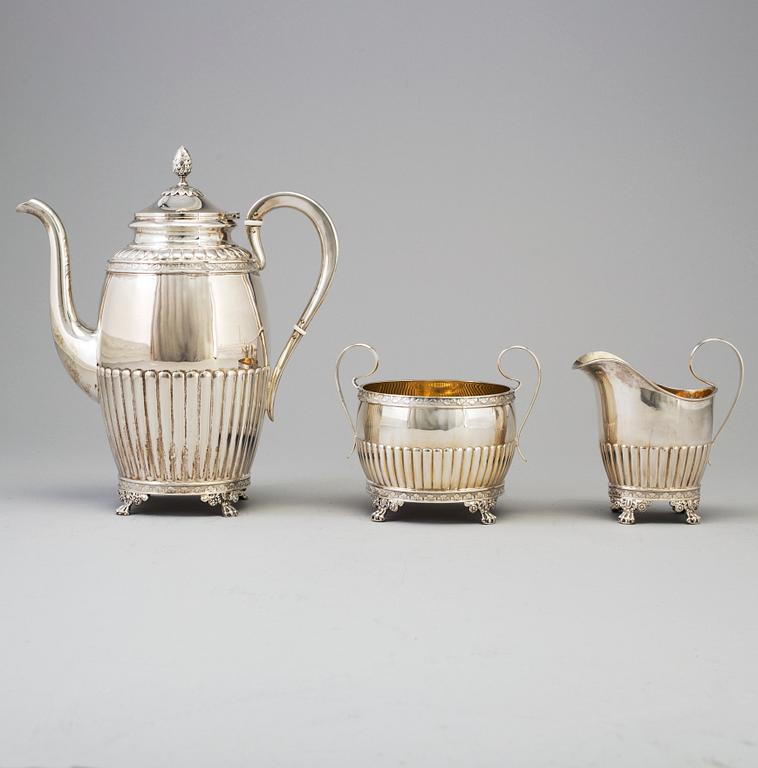 A 3 part silver coffee service dated 1919.