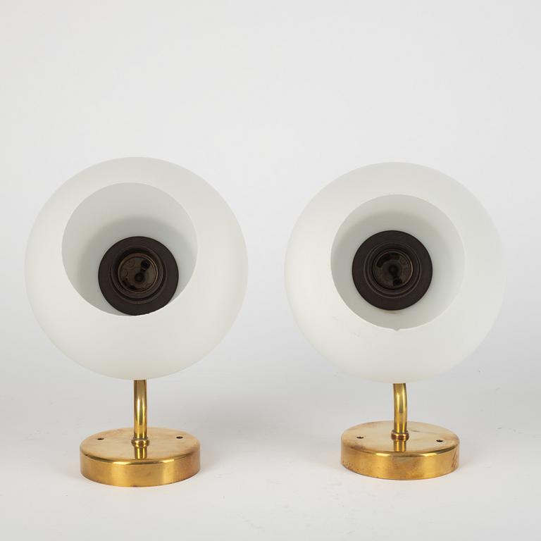 Harald Notini, a pair of model "8721" wall lamps, Arvid Böhlmarks Lampfabrik, Sweden, 1950's.