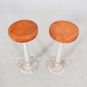 A pair of Necchi leather and metal bar stools later part of the 20th century.
