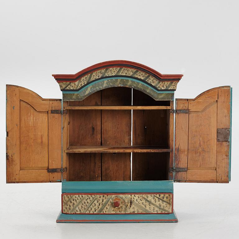 A Swedish provincial wall cabinet, possibly from Dalarna, early 19th century.