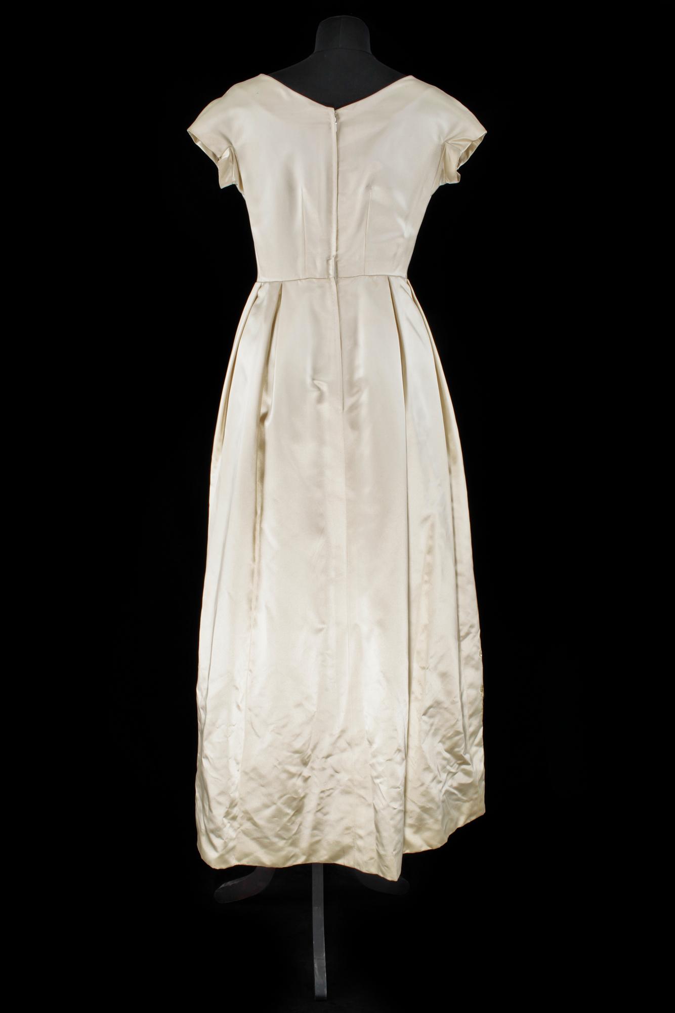A cream colored silk wedding dress/evening dress by Mea.