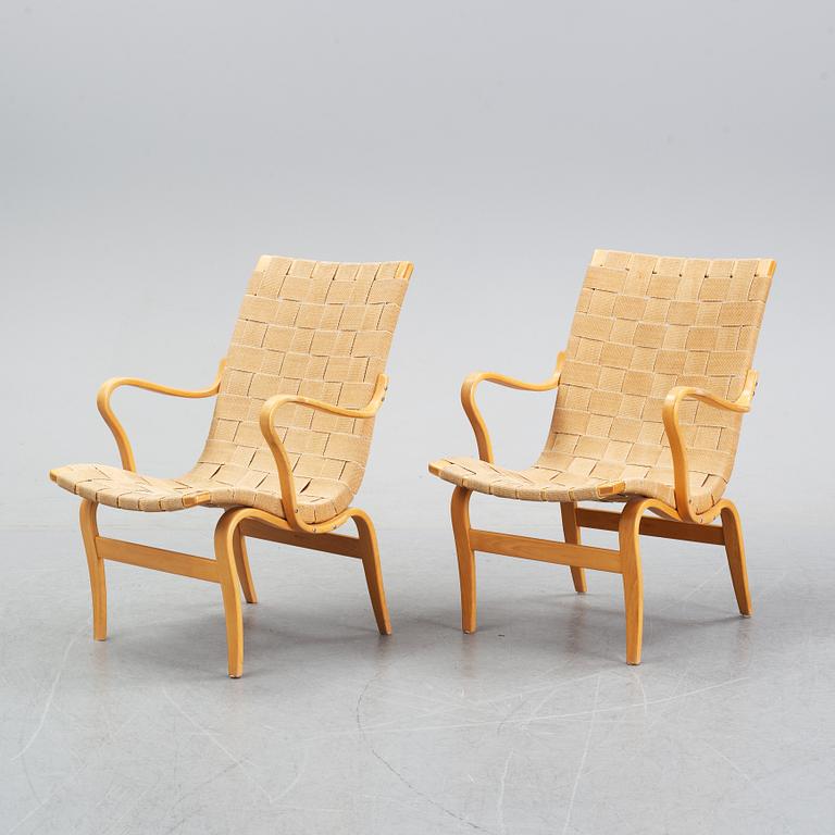 A pair of 'Eva' easy chairs by Bruno Mathsson for Firma Karl Mathsson, dated 1974.