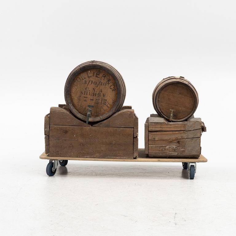 A pair of oak wine casks on stands, early 20th century.