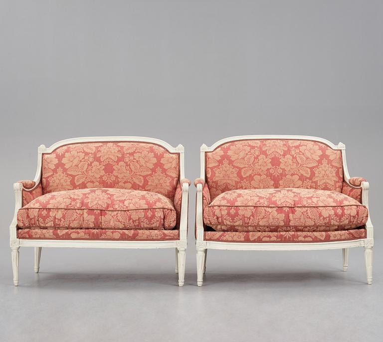 A pair of Louis XVI late 18th Century armchairs by M. dela Porte (Paris 1765-1784).
