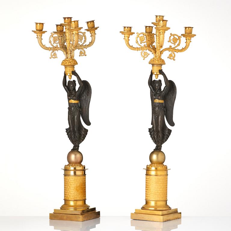 A pair of French Empire five-light candelabra, attributed to Francois Rabiat (bronze maker in Paris 1756-1815).