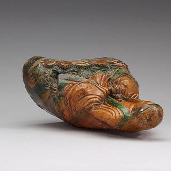 A seated green and yellow glazed deity, Ming dynasty (1368-1644).