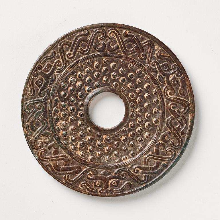 An archaistic bi disc.
