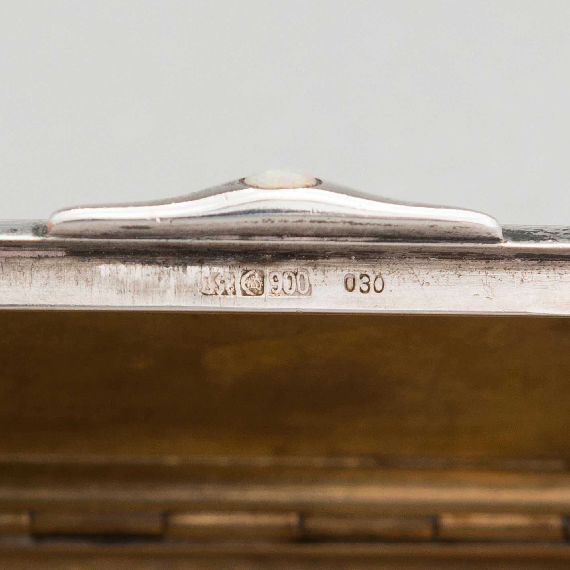 Three silver cigarette cases and a silver pillbox, marked in Finland and Germany, first half of the 20th Century.