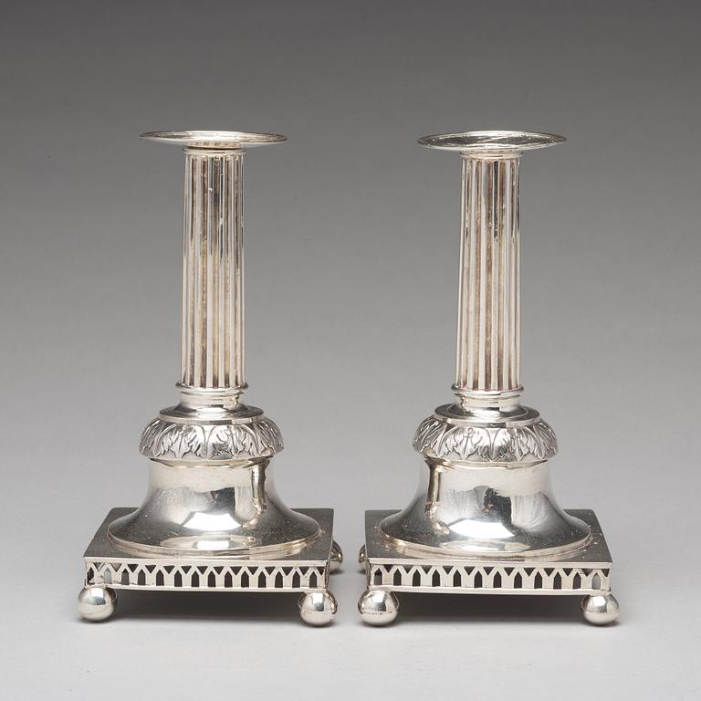 A pair of Swedish aerly 19th century silver candlesticks, mark of Carl Gustaf Blomborg, Stockholm 1815.