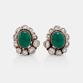 696. A pair of earrings with cabochon cut emeralds and brilliant cut diamonds. Total carat weight 0.68 ct.