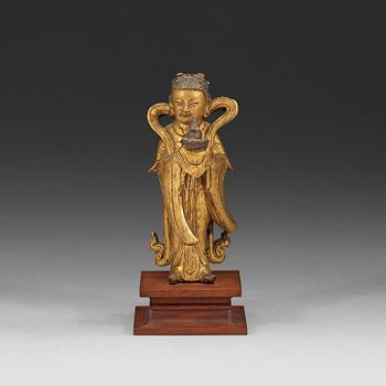 56. A gilt bronze figure of Longnü, Ming Dynasty, 17th century.